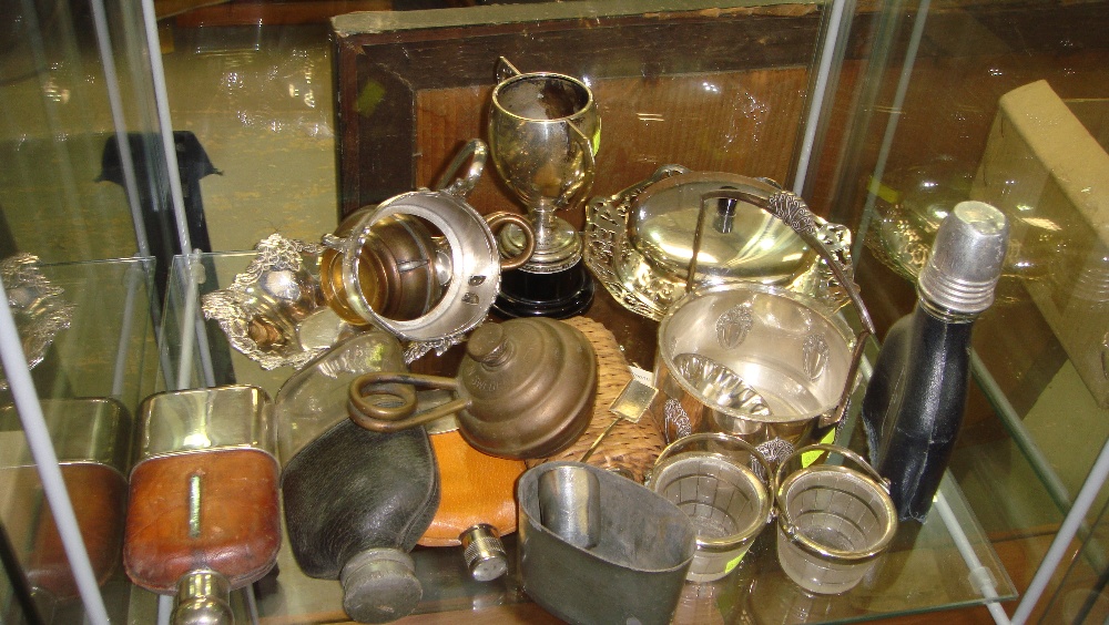 Shelf of assorted silver plated ware including hip flasks