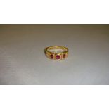 18 ct yellow gold ring set with 3 graduated red tourmalines 55.