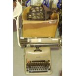 Vintage typewriter and box of hanging wall lights