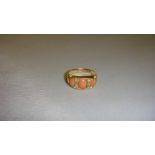 18 ct gold ring set with small diamonds and three graduated cabouchon pink coral 50 m