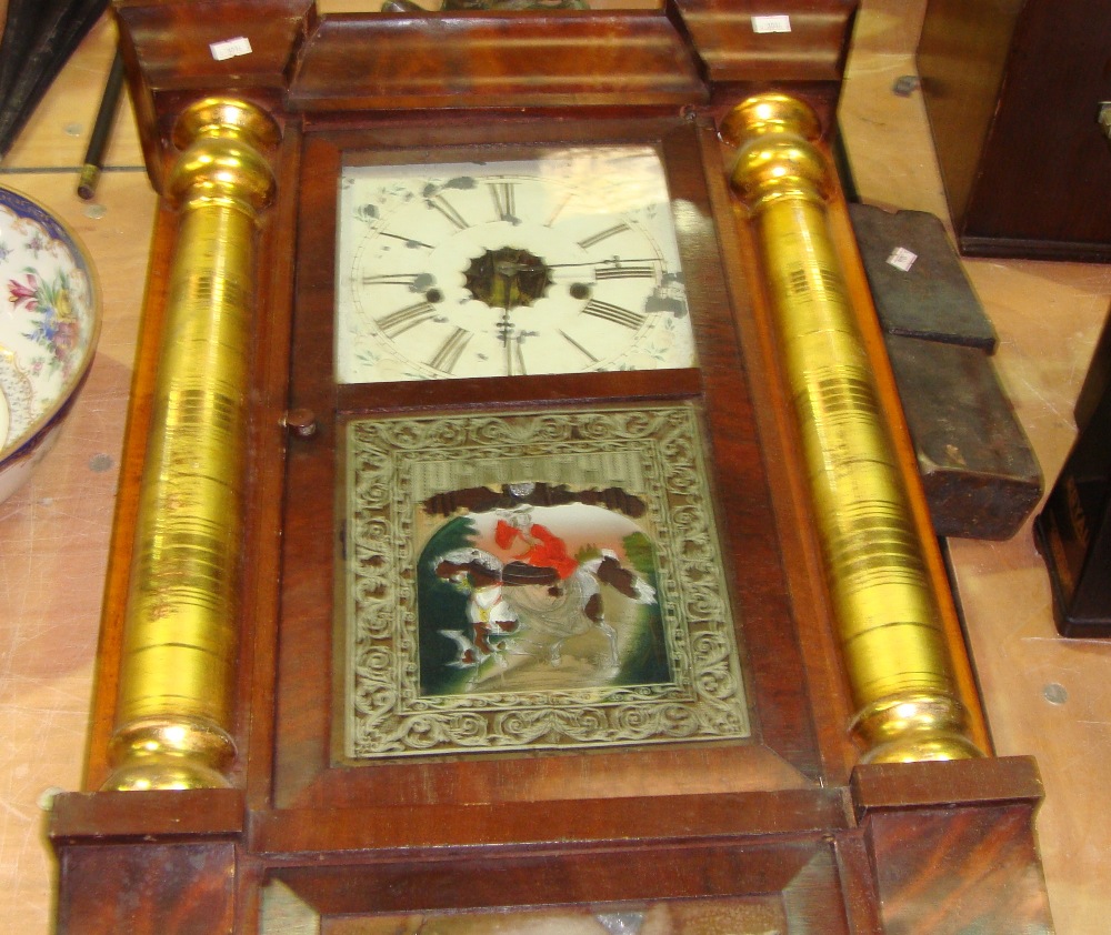 Late 19th century American wall clock with mahogany case gilded columns & painted glass panels