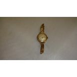 Vintage ladies wristwatch in 9 ct gold case with rolled gold strap
