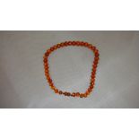 Set of early 20th century silk strung faceted amber beaded necklace (25 g)