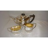Solid silver Neo Classical shape three part harlequin tea set with lobed edges,