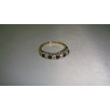 Vintage 9 ct gold ring set with four sapphires & chip diamonds