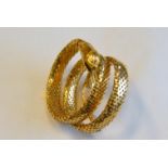 BRACCIALE IN ORO GIALLOmodellato a serpente, punzone 750, 48 g alcune ammaccature