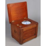 A Victorian mahogany commode with flushing mechanism and original blue and white pottery liner J. W.