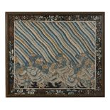 A 19th century framed Chinese silk needlework panel in blue and yellow tones depicting wave scrolls