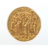An Islamic gold Byzantine style coin three imperial figures,