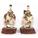 A pair of 19th century Chinese carved polychrome ivory figural snuff bottles.