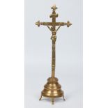 A 19th century French bronze corpus Christi raised on a stepped demi lune plinth, 31cm.