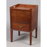 A George III mahogany washstand with tambour front,
