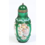 A Chinese opaque white glass snuff bottle with spinach jade stopper.