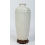 An 18th century Chinese high shouldered blanc de chine vase on hardwood plinth.