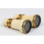 A pair of lacquered brass and ivory mounted opera glasses by Negretti & Zambra, London, 10cm closed.