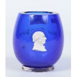 A Victorian cobalt blue glass vase with white cameo portrait.