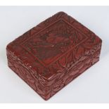 A Chinese lacquered wood box of rectangular form.