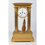 A large early 19th century French gilt bronze portico clock.