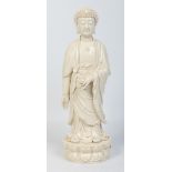 A Chinese large Dehua blanc de chine figure of a Buddha.