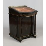 A Victorian ebonized Davenport writing desk with gilt metal gallery,