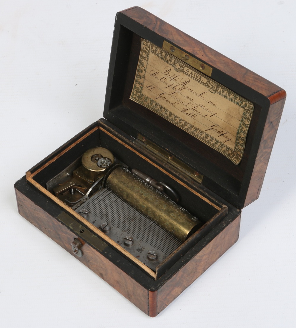 A miniature 19th century Swiss walnut cased cylinder music box. Comb stamped C. P. & G. 12.5cm wide.
