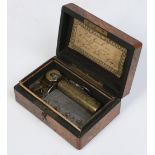 A miniature 19th century Swiss walnut cased cylinder music box. Comb stamped C. P. & G. 12.5cm wide.