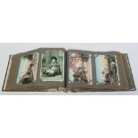 An early 20th century postcard album containing approximately 150 Japanese postcards.