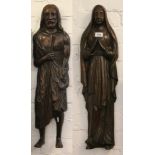 A pair of Medieval style carved hardwood wall mounting figures formed as Mary and Joseph, 70cm.