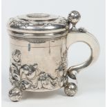 A Swedish silver peg tankard with hinged domed cover, double scrolling handle with shield terminal,