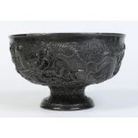 A Japanese white metal pedestal bowl, deeply chased with a ground of chrysanthemums and two dragons,