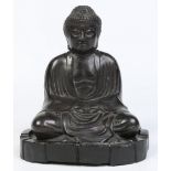 A Chinese bronze figure of a seated meditating Buddha raised on a carved hardwood plinth, 24cm.