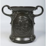 An Arts and Crafts twin handled pewter jardiniere.