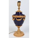 A Sevres style Neoclassical urn shaped tablelamp.