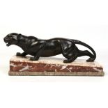An Art Deco patinated bronze figure of a stalking panther. Raised on a tri colour marble plinth.