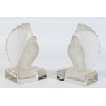 A pair of Lalique style frosted glass bookends each modelled with a peacock, 15cm.
