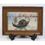 A framed micro mosaic plaque of a gondolier on the Grand Canal at Venice, 11.5cm x 18.5cm.