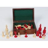 An early twentieth century Continental carved bone chess set. The opposing side stained in red.