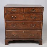 A small George II oak chest of two over three drawers,