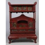A Japanese Meiji period lacquered shodana display cabinet.