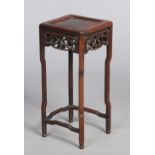 A 19th century Chinese hardwood small jardiniere stand. With faux bamboo pierced frieze, 52.5cm.