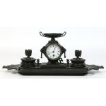 A 19th century French patinated bronze desk stand of Neoclassical form.