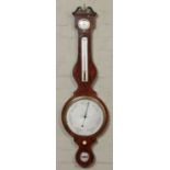 A Regency inlaid mahogany banjo barometer. With brass bezels and silvered dials. Signed G.