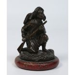 An early 20th century small patinated bronze figure of a Turkish rifleman, 9.5cm.