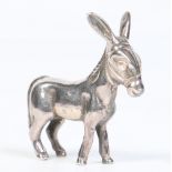 An Imported novelty silver model of a donkey. Import marks for London 1979. 38 grams, 5cm.