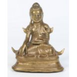 An antique Oriental polished bronze figure of a seated Buddha with glass inset eyes, 15cm.