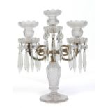 A cut lead crystal and gilt metal three branch candelabra adorned with hanging droplets, 37.5cm.