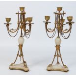 A pair of 19th century Neoclassical style gilt bronze and alabaster three branch candelabrum.