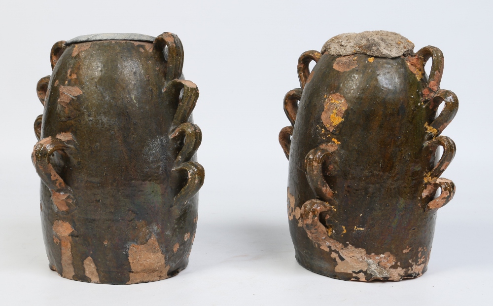 Two 18th century French glazed terracotta chimney pots with loop mouldings 24cm.