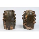 Two 18th century French glazed terracotta chimney pots with loop mouldings 24cm.