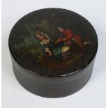 A 19th century lacquered papier mache circular box and cover.
